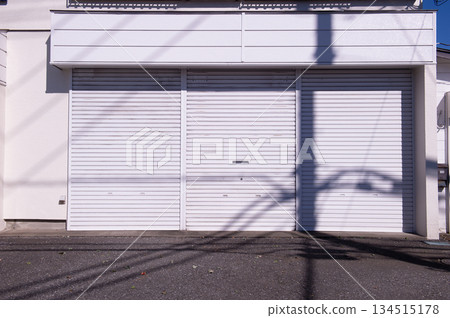 A closeup shot of automatic metal roller door used in factory, storage, garage, and industrial warehouse. The corrugated and foldable metal sheet offer space saving and provide urban and rustic feel 134515178