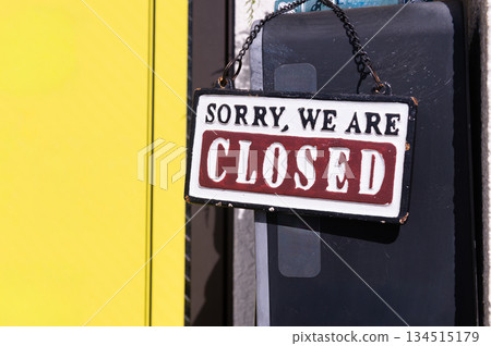 sorry we are closed sign hanging outside a restaurant, store, office or other sorry we are closed sign hanging outside a restaurant, store, office or other 134515179