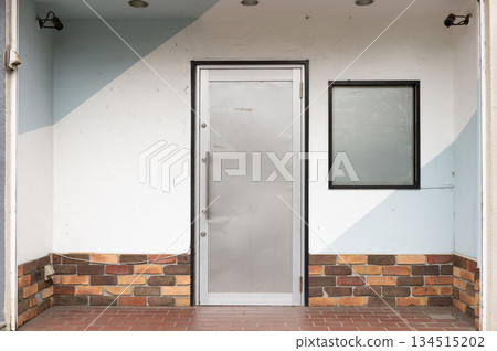 sidewalk by street wall and door sidewalk by street wall and door 134515202