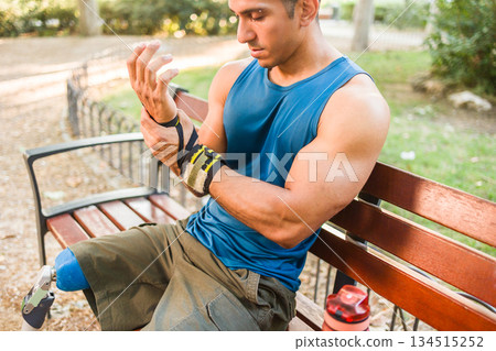 Venezuelan amputee athlete sitting resting wrist 134515252