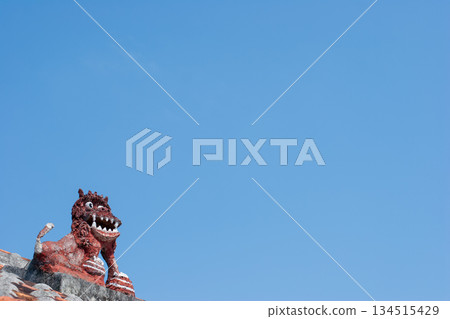 Taketomi Island - Shisa on a red tiled roof Taketomi Island - Shisa on a red tiled roof 134515429