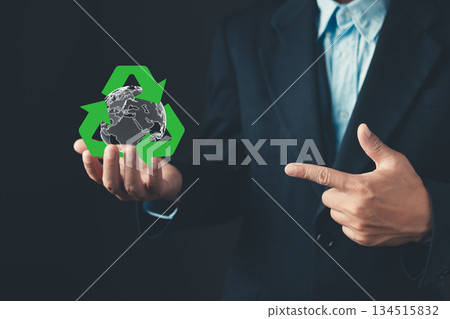 businessman hold digital Earth encircled by a green recycle symbol, representing global sustainability, environmental responsibility, eco-conscious business practices, and green corporate initiatives. businessman hold digital Earth encircled by a green recycle symbol, representing global sustainability, environmental responsibility, eco-conscious business practices, and green corporate initiatives. 134515832