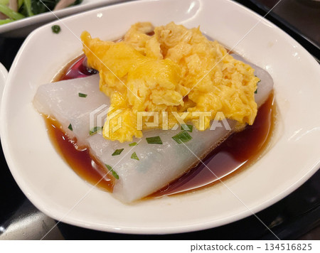 Chinese-style chewy steamed crepes topped with scrambled eggs Chinese-style chewy steamed crepes topped with scrambled eggs 134516825
