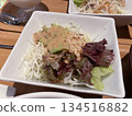 Green salad with sesame dressing 134516882