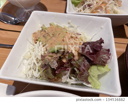 Green salad with sesame dressing; a flavorful Japanese-style salad. Green salad with sesame dressing; a flavorful Japanese-style salad. 134516882
