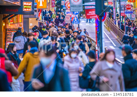 Yokohama cityscape in Japan at the end of the year. In front of Sotetsu Yokohama Station. Overlooking the no-smoking area, Parnade ST, and other areas. Many people are using their smartphones while walking. 134518781