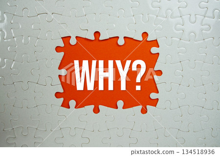 Jigsaw puzzle with a missing piece with "Why?" on orange background 134518936