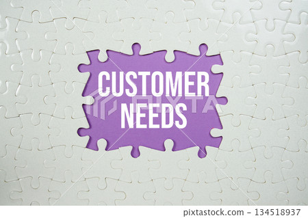 Jigsaw puzzle with a missing piece with "Customer Needs" on purple background Jigsaw puzzle with a missing piece with "Customer Needs" on purple background 134518937