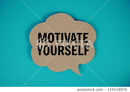 Motivate Yourself text with speech bubble top view on blue background Motivate Yourself text with speech bubble top view on blue background 134518978