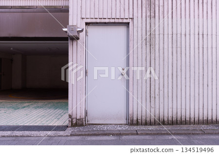 sidewalk by street wall and door sidewalk by street wall and door 134519496