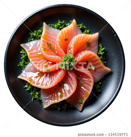 Beautiful fresh salmon sashimi appetizer dish arranged in delicate flower shape, drizzled with ponzu dressing 134519771