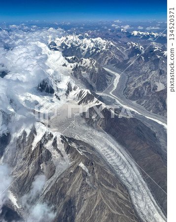 Glaciers of the Hindu Kush Mountains seen from an airplane flight between Dubai and Haneda 134520371