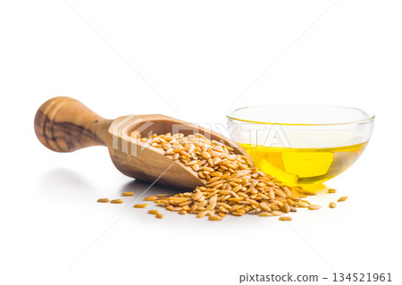 Golden linseed or flaxseed and oil. Healthy flax seed isolated on white background. 134521961