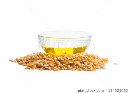 Golden linseed or flaxseed and oil. Healthy flax seed isolated on white background. 134521962