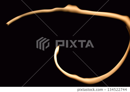 Abstract glowing shape on black background. Abstract glowing shape on black background. 134522744