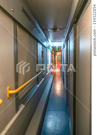 corridor coach wagon of a train.  134522854