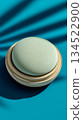 Cushion foundation on a turquoise background 134522900