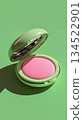 Cushion foundation on a green background 134522901