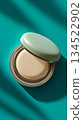 Cushion foundation on a turquoise background 134522902