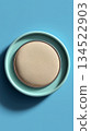 Cushion foundation on a turquoise background 134522903