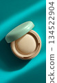 Cushion foundation on a turquoise background 134522904