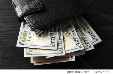 Big Leather Wallet With Usa Dollars On A Table 134523442