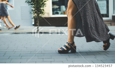 Stylish Young Woman In Dress And Naked Legs Walking The Street 134523457