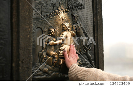 Tourist Hands Touching Bronze Girl For Luck Tourist Hands Touching Bronze Girl For Luck 134523499