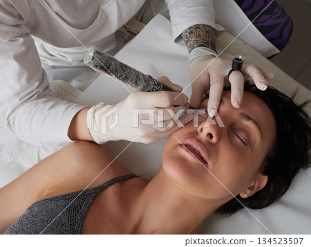 professional tattooist making permanent make up professional tattooist making permanent make up 134523507