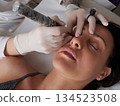 professional tattooist making permanent make up 134523508