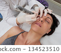 professional tattooist making permanent make up 134523510