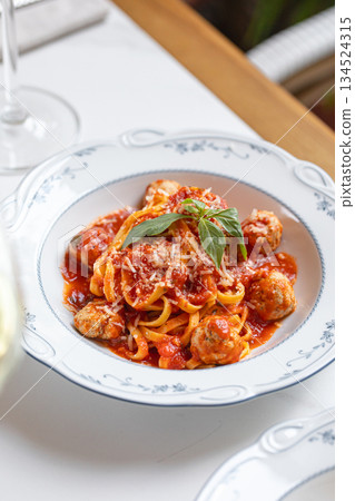 Spaghetti with meatballs in tomato sauce Spaghetti with meatballs in tomato sauce 134524315