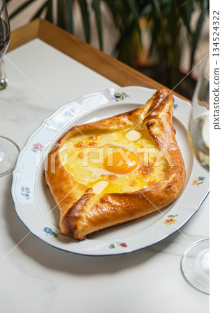 Adjarian khachapuri with egg and cheese 134524322