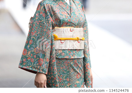 A woman in a kimono A woman in a kimono 134524476