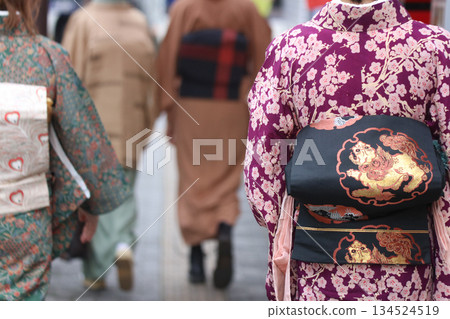 A woman walking in a kimono A woman walking in a kimono 134524519