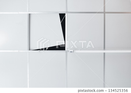 Suspended ceiling with opened service maintenance hole and fluorescent light Suspended ceiling with opened service maintenance hole and fluorescent light 134525356