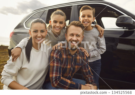 Happy Family Portrait Near the Car During Vacation Happy Family Portrait Near the Car During Vacation 134525568