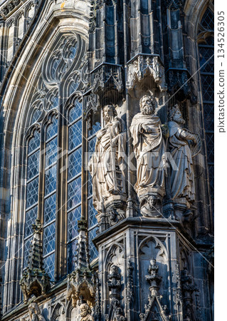 Aachen Cathedral Gothic window tracery and apostle statues close up Aachen Cathedral Gothic window tracery and apostle statues close up 134526305