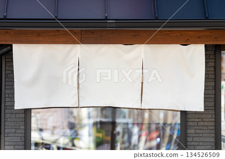 The curtain-like fabric that hangs in front of traditional Japanese restaurants and shops not only serves as a signboard, but holds a larger meaning, 134526509