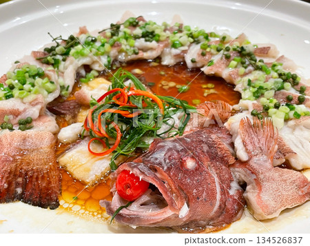 Chinese banquet dish: Peacock Opening Screen Steamed Stone Spot Fish (Chinese Steamed Grouper) 134526837
