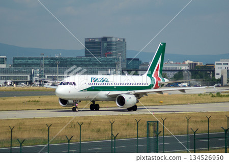 Frankfurt, Germany, July 09 2017: Italian Airbus A320 Taxiing Past Spotting Point Toward Runway Frankfurt, Germany, July 09 2017: Italian Airbus A320 Taxiing Past Spotting Point Toward Runway 134526950