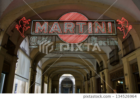 Turin, Italy, September 14, 2019: Vintage Martini Neon Sign on Arcade in City Center Turin, Italy, September 14, 2019: Vintage Martini Neon Sign on Arcade in City Center 134526964