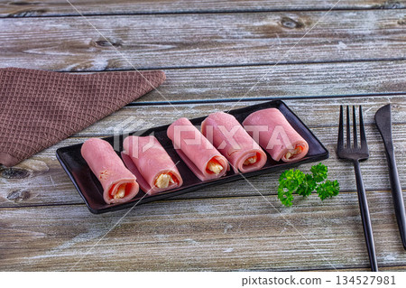 Wrapped ham and cheese roll 134527981