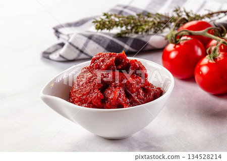 Red organic fresh tomato paste 134528214