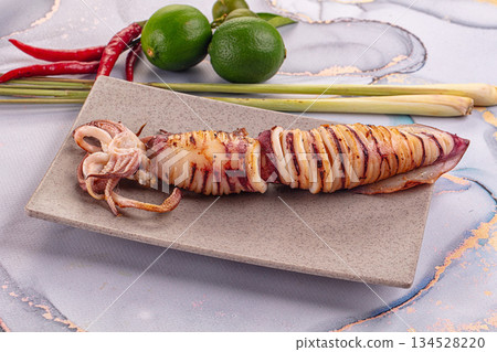 Tasty grilled wild squid with lime Tasty grilled wild squid with lime 134528220
