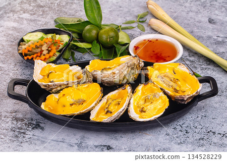 Baked oyster with cheddar cheese 134528229