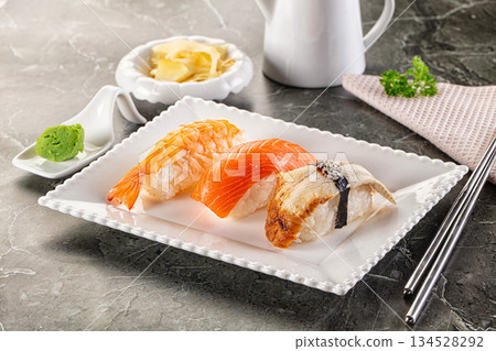 Japanese cuisine - sushi with eel, salmon and prawn Japanese cuisine - sushi with eel, salmon and prawn 134528292