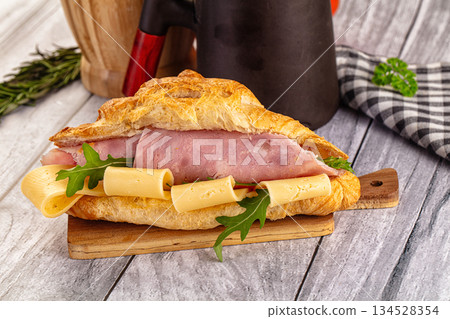 Fresh croissant with ham and cheese Fresh croissant with ham and cheese 134528354