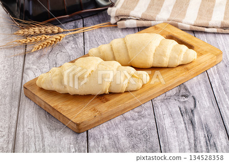 Raw uncooked croissant for bake 134528358