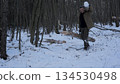 Winter bushcraft in the forest, Carrying logs 134530498
